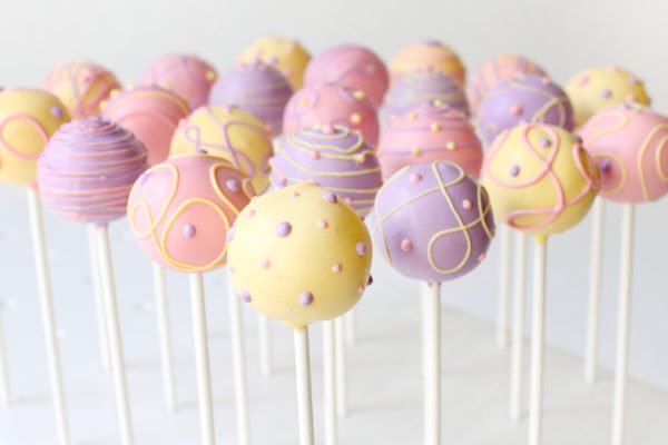 Cake Pops In Pink, Purple and Yellow with fun swirls