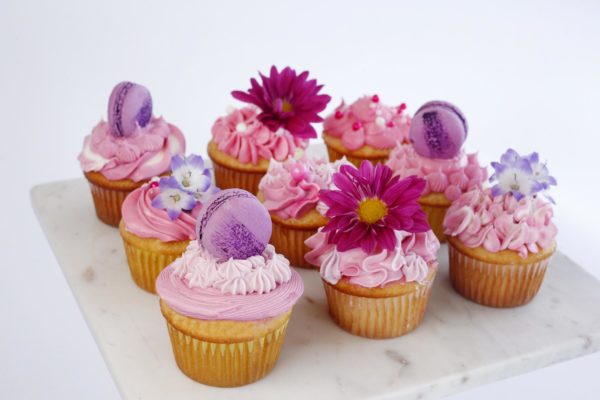 Buttercream Cupcakes with flowers and macarons - extra fun!