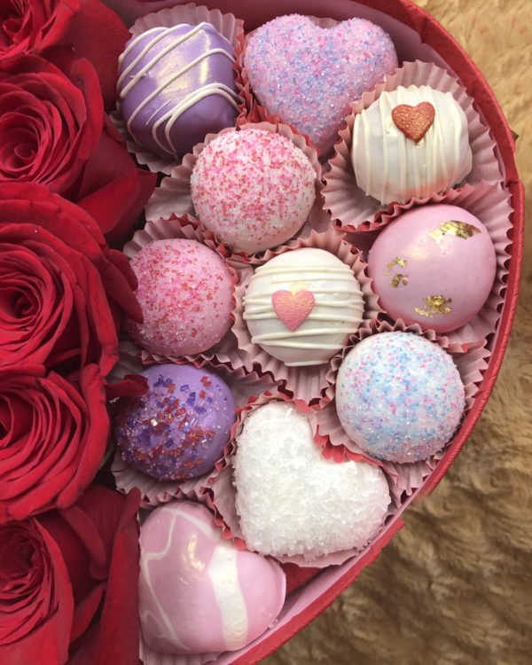 Beautiful Box filled with red roses and an assortment of cake bites in lemon, red velvet and chocolate chip.