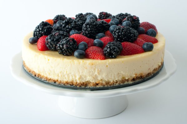 9" round cheesecakes with berries on top.